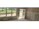 Unfinished living room features great natural light from the large window and glass door at 2808 Lillian Ln, Douglasville, GA 30135