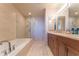 Bathroom featuring a soaking tub, glass shower, double sink vanity and modern fixtures at 3630 Peachtree Ne Rd # 2706, Atlanta, GA 30326