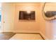 Cozy bedroom featuring wall mounted TV and pink striped wallpaper at 3630 Peachtree Ne Rd # 2706, Atlanta, GA 30326