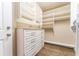 Organized closet with white shelving, drawers, and hardwood flooring at 3630 Peachtree Ne Rd # 2706, Atlanta, GA 30326