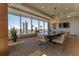 Sunlit conference room featuring a stylish table, greenery, and great city views at 3630 Peachtree Ne Rd # 2706, Atlanta, GA 30326