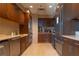 Well-equipped kitchen with stainless steel appliances and dark wood cabinets at 3630 Peachtree Ne Rd # 2706, Atlanta, GA 30326