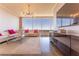 Living room with city view, modern lighting, hardwood floors, and stylish furniture at 3630 Peachtree Ne Rd # 2706, Atlanta, GA 30326