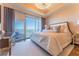 A luxurious main bedroom is adorned with a glamorous chandelier and stunning city views at 3630 Peachtree Ne Rd # 2706, Atlanta, GA 30326