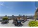 A luxurious outdoor patio with a glass barrier providing panoramic views of the surrounding city skyline at 3630 Peachtree Ne Rd # 2706, Atlanta, GA 30326