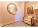 Cozy sitting area featuring a round mirror, an art piece and a comfortable chair at 3630 Peachtree Ne Rd # 2706, Atlanta, GA 30326