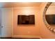 Sitting area features a mounted TV and a large circular mirror at 3630 Peachtree Ne Rd # 2706, Atlanta, GA 30326