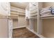 Spacious walk-in closet with custom shelving, drawers, and ample storage at 3630 Peachtree Ne Rd # 2706, Atlanta, GA 30326
