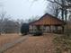 Outdoor community pavilion with picnic tables and fireplace overlooking a pond at 4308 Glenlake Court Northwest, Kennesaw, GA 30144