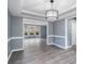 Bright dining room with chandelier and gray walls at 4308 Glenlake Court Northwest, Kennesaw, GA 30144