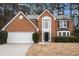 Two-story brick home with a black front door at 4308 Glenlake Court Northwest, Kennesaw, GA 30144