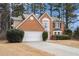 Brick house with attached garage and driveway at 4308 Glenlake Court Northwest, Kennesaw, GA 30144