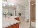 Elegant bathroom with a large vanity, shower, and patterned wallpaper at 1401 Walcutts Nw Way, Marietta, GA 30064
