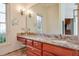 Bathroom with granite countertop and large mirror at 1401 Walcutts Nw Way, Marietta, GA 30064