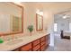 Double vanity bathroom with a view into a bedroom and ample counter space at 1401 Walcutts Nw Way, Marietta, GA 30064