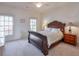 Spacious bedroom with a dark wood sleigh bed and plenty of natural light at 1401 Walcutts Nw Way, Marietta, GA 30064