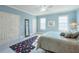 Light blue bedroom with a king-size bed and a cheerful atmosphere at 1401 Walcutts Nw Way, Marietta, GA 30064