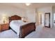 Bright bedroom with a wooden sleigh bed, ample space, and access to a bathroom at 1401 Walcutts Nw Way, Marietta, GA 30064