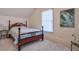 Charming bedroom with a wooden bed frame and large window at 1401 Walcutts Nw Way, Marietta, GA 30064