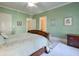 Light and airy bedroom with a comfortable bed and en-suite bathroom at 1401 Walcutts Nw Way, Marietta, GA 30064