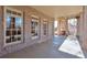 Spacious covered patio with brick columns and large windows at 1401 Walcutts Nw Way, Marietta, GA 30064