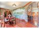 Dining room with hardwood floors, stone wall, and mural at 1401 Walcutts Nw Way, Marietta, GA 30064