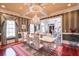 Formal dining room with hardwood floors, chandelier, and striped walls at 1401 Walcutts Nw Way, Marietta, GA 30064