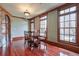 Dining room with hardwood floors, wood trim, and a charming table setting at 1401 Walcutts Nw Way, Marietta, GA 30064