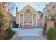 Brick home with a circular driveway and manicured landscaping at 1401 Walcutts Nw Way, Marietta, GA 30064