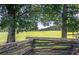 Rustic split-rail fence with a field and trees at 1401 Walcutts Nw Way, Marietta, GA 30064