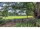 Rustic split-rail fence, lush green field and trees at 1401 Walcutts Nw Way, Marietta, GA 30064