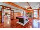 Game room with pool table, hardwood floors, fireplace, and access to living room at 1401 Walcutts Nw Way, Marietta, GA 30064