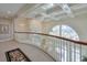 Curved hallway with a coffered ceiling and large windows, providing natural light at 1401 Walcutts Nw Way, Marietta, GA 30064
