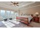 Spacious main bedroom with large windows and wooden bed frame at 1401 Walcutts Nw Way, Marietta, GA 30064