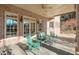Covered patio with seating area and access to house at 1401 Walcutts Nw Way, Marietta, GA 30064