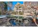 Kidney shaped pool with stone coping and spa at 1401 Walcutts Nw Way, Marietta, GA 30064