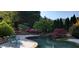 Tranquil pool with stonework and mature trees at 1401 Walcutts Nw Way, Marietta, GA 30064