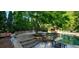 Peaceful poolside patio with stonework and seating at 1401 Walcutts Nw Way, Marietta, GA 30064