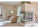 Relaxing sitting area with fireplace and comfortable armchairs at 1401 Walcutts Nw Way, Marietta, GA 30064