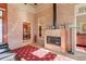 Sunroom featuring a fireplace and brick wall at 1401 Walcutts Nw Way, Marietta, GA 30064