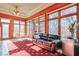 Sunroom with a comfortable couch and views of the backyard at 1401 Walcutts Nw Way, Marietta, GA 30064