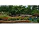 Serene pool and patio with stone accents at 1401 Walcutts Nw Way, Marietta, GA 30064