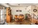 Cozy dining room with wooden table and chairs near a sliding glass door at 230 Cobblestone Ln, Mcdonough, GA 30252