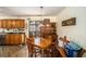 Dining area with wooden table and chairs, and a sliding glass door at 230 Cobblestone Ln, Mcdonough, GA 30252