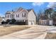 View of the home's garage, driveway and backyard shed at 230 Cobblestone Ln, Mcdonough, GA 30252