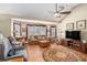Comfortable living room with neutral colors and a large window at 230 Cobblestone Ln, Mcdonough, GA 30252