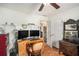 Office with desk, dual monitors, hardwood floors and plenty of natural light at 230 Cobblestone Ln, Mcdonough, GA 30252