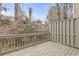 Private wooden deck with a gray wooden fence, surrounded by natural landscaping at 3044 Lauren Parc Rd, Decatur, GA 30032