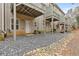 Backyard view with rock ground covering and elevated patio decks above at 3044 Lauren Parc Rd, Decatur, GA 30032