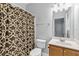 Bathroom with a patterned shower curtain and vanity with traditional faucet at 3044 Lauren Parc Rd, Decatur, GA 30032